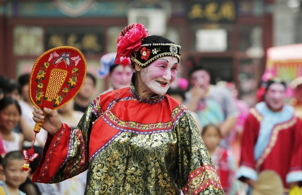 A performer dances at a Dragon Boat festival in Beijing