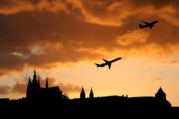 Planes departing Prague at sunset.