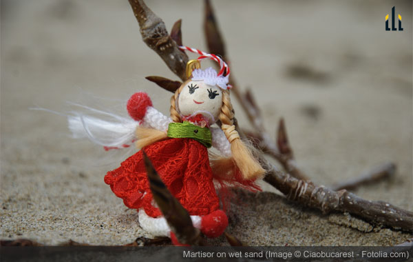 martisor puppett on the wet sand