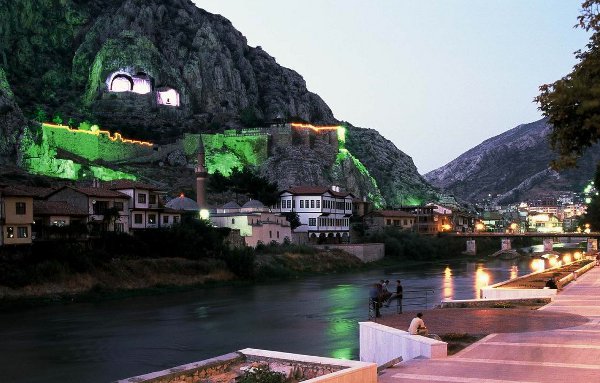 The tombs from across the river at night. 