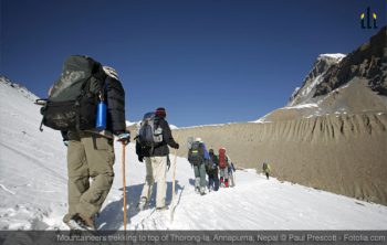 mountaineers trekking to top of thorong-la, annapurna, nepal