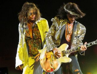 Steven Tyler (left) and Joe Perry (right) performing at the Nassau Coliseum on July 1, 2012