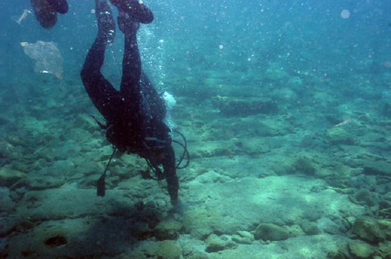 Divers exploring the sunken city of Olus