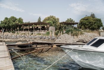 Santa Marina Beach Bar sunbeds and mooring