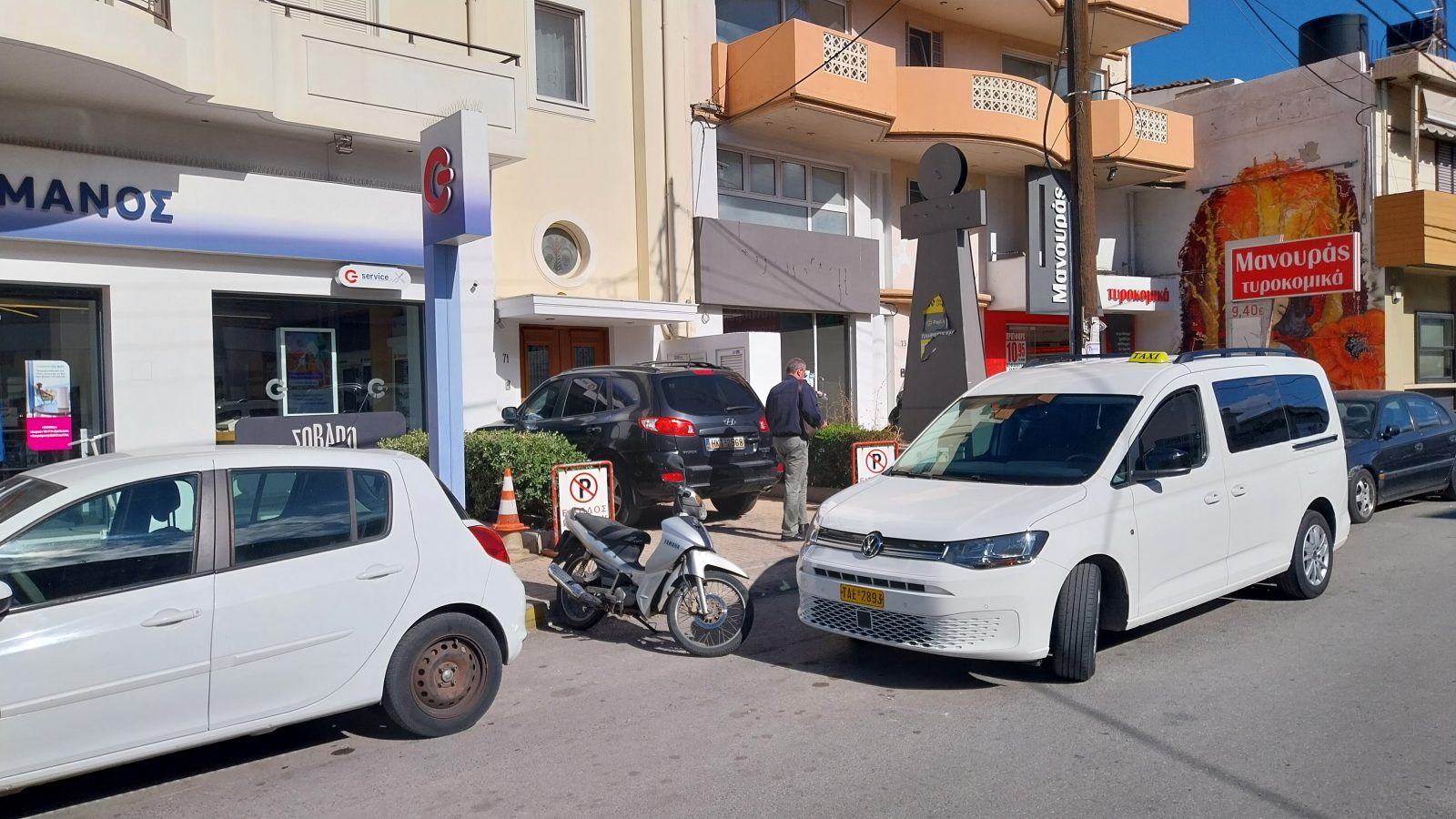 taxi blocking a driveway