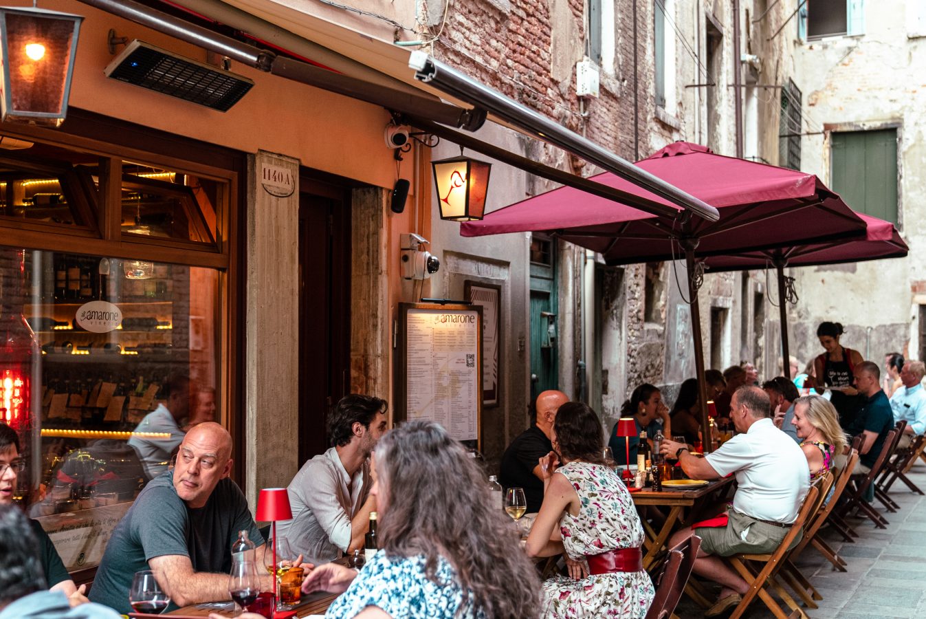 Guests seated outside Vineria all’ Amarone.