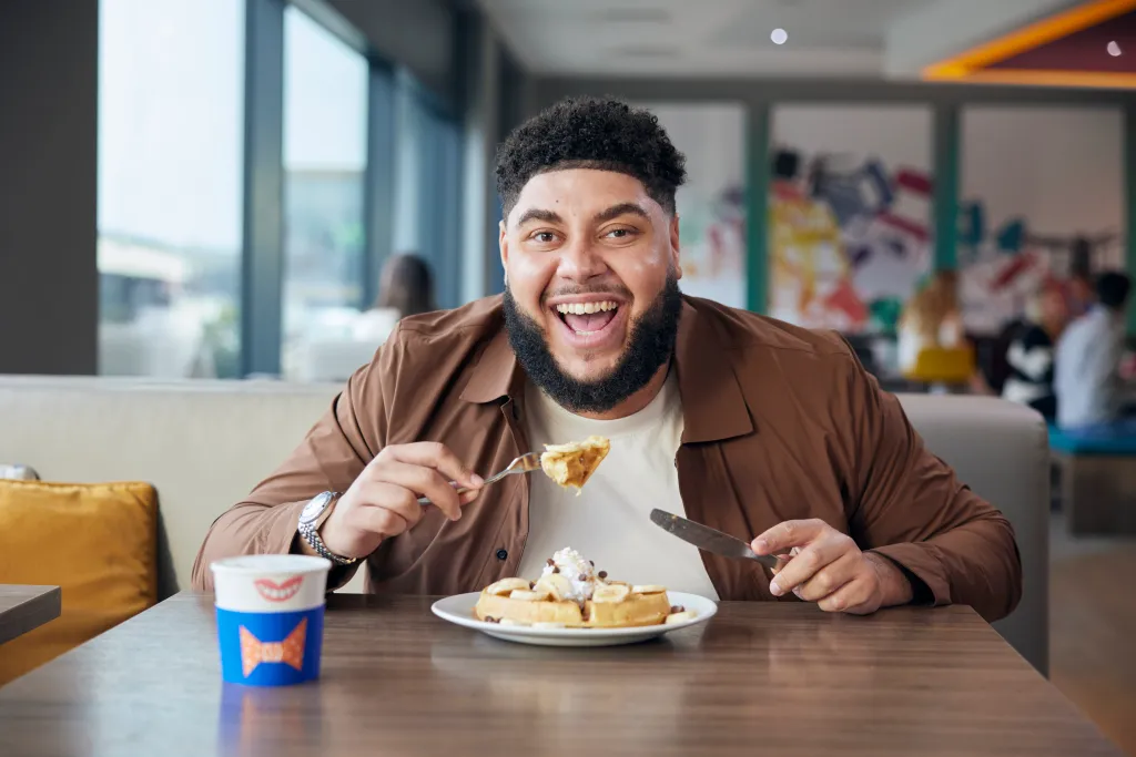 Big Zuu smiling at Hampton by Hilton